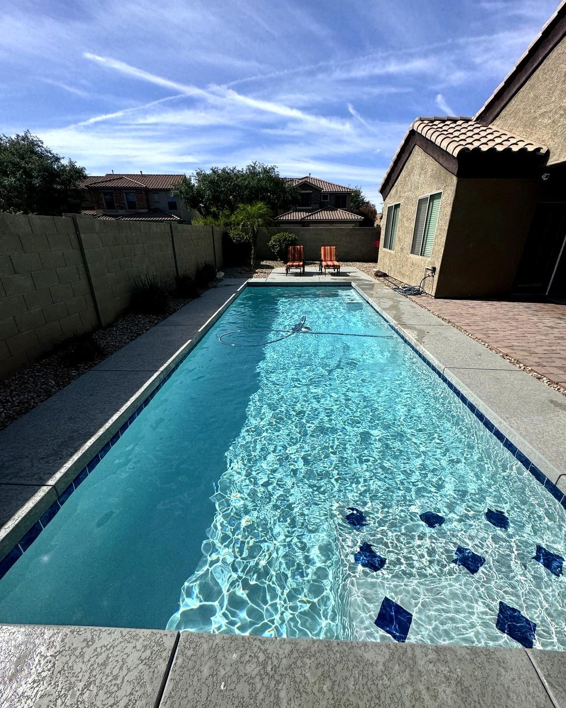 Clean backyard pool serviced by Cardwell Pool Care